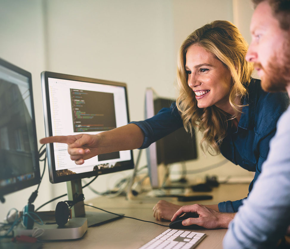 Web development banner- two peoples, are looking at the computer monitor.