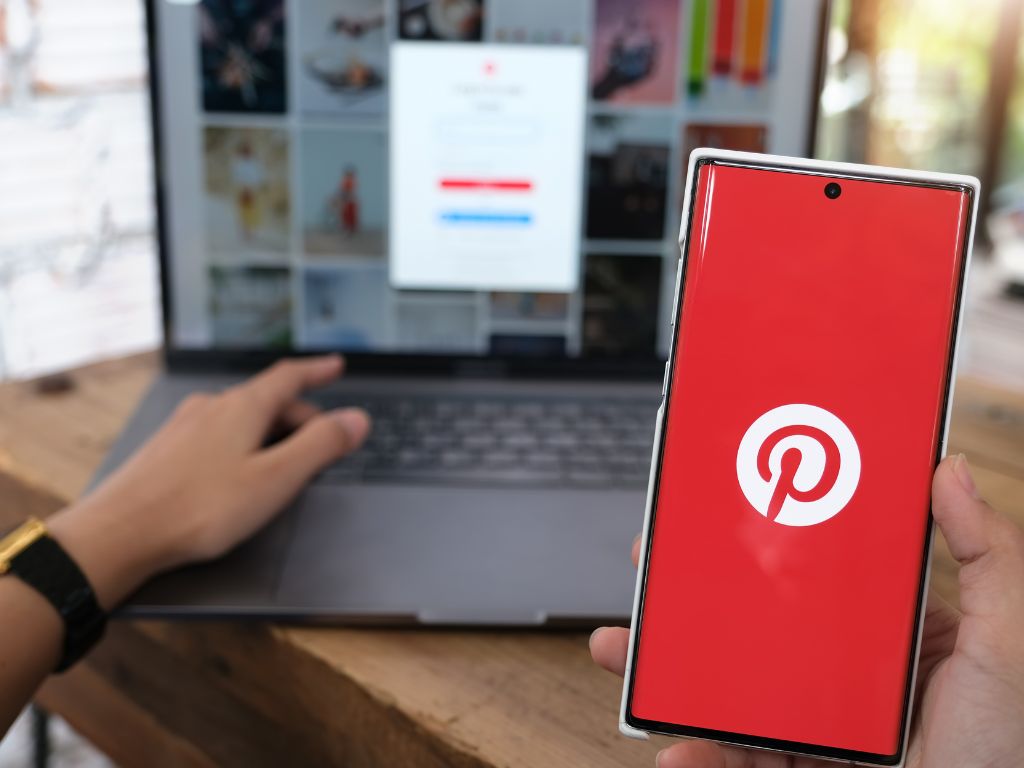 Pinterest logo on smartphone and laptop
